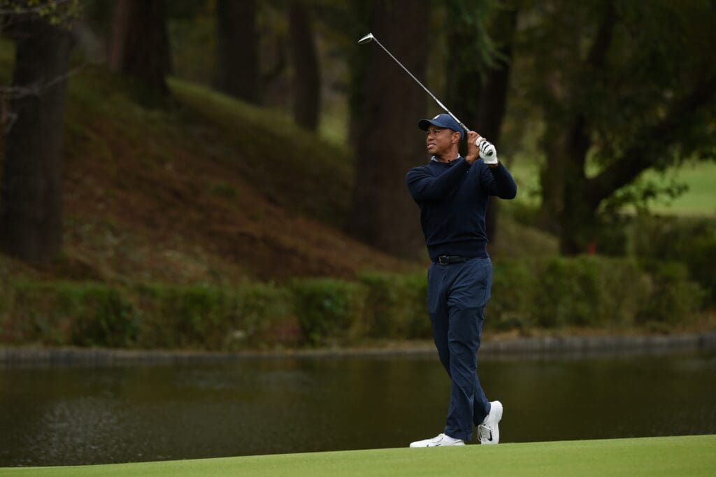 Tiger Woods plays a shot on the 6th hole during The Challenge: Japan Skins golf competition at Accordia Golf Narashino Country Club.