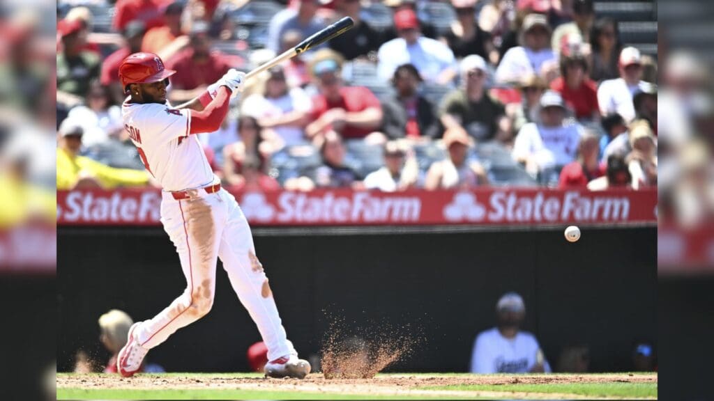 May 25, 2025; Anaheim, California, USA; Los Angeles Angels shortstop Tim Anderson (77) forced out at first base against the Miami Marlins during the sixth inning at Angel Stadium.