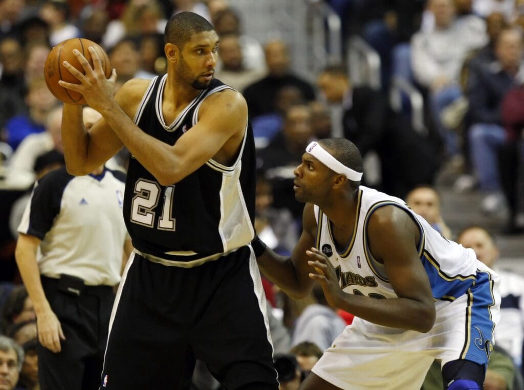 January 2, 2010; Washington, DC, USA; San Antonio Spurs center Tim Duncan (21) protects the ball from Washington Wizards center Brendan Haywood (33) at Verizon Center. The Spurs won 97-86.