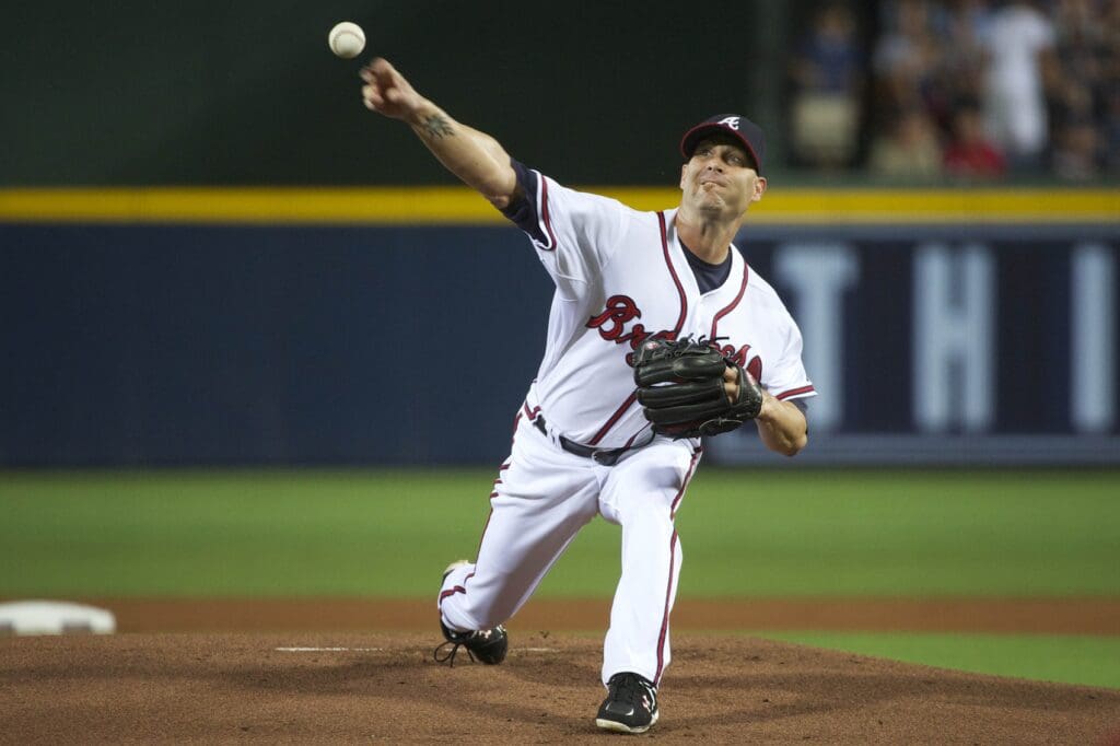 July 25, 2011; Atlanta, GA, USA; Atlanta Braves starting pitcher Tim Hudson (15) delivers a pitch against the Pittsburgh Pirates during the first inning at Turner Field.