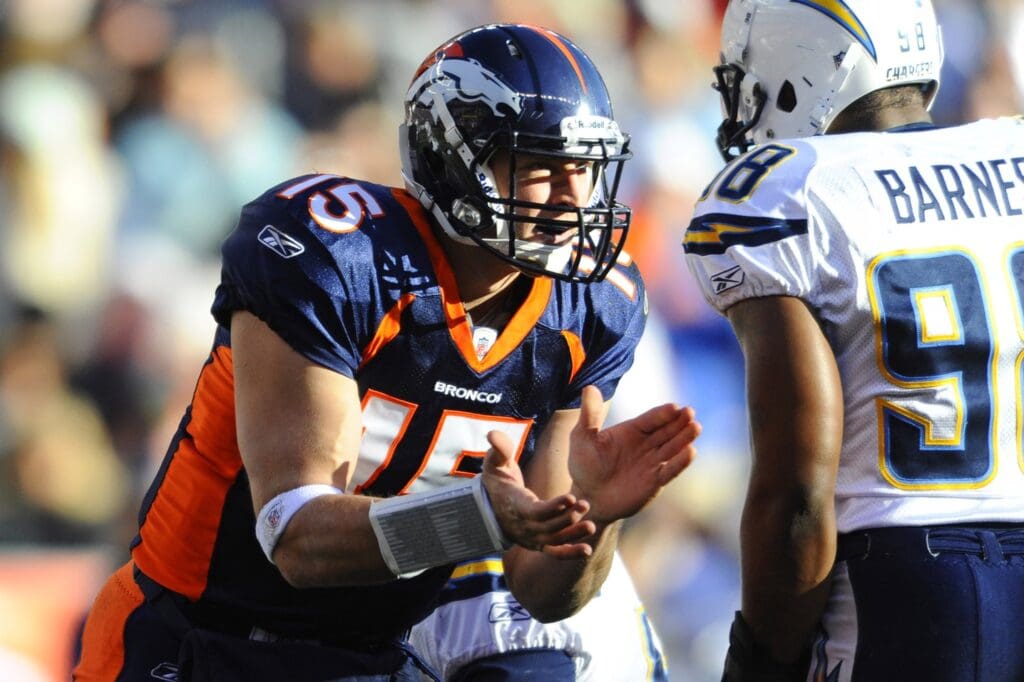 Jan 2, 2011; Denver, CO, USA; Denver Broncos quarterback Tim Tebow (15) cheers the first down made by himself on a run in the first quarter against the San Diego Chargers at Invesco Field.