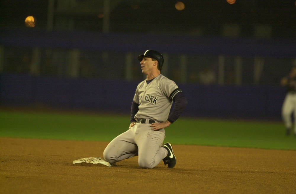 Oct 25, 2000; New York, NY, USA; Tino Martinez kneels on second base after being tagged out in the fourth inning.