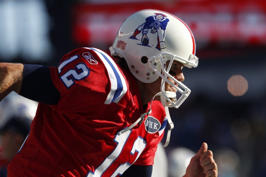 Oct 9, 2011; Foxborough, MA, USA; New England Patriots quarterback Tom Brady (12) warms up before the game against the New York Jets at Gillette Stadium.