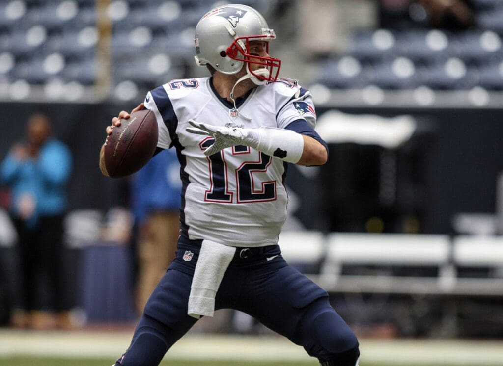Dec 1, 2013; Houston, TX, USA; New England Patriots quarterback Tom Brady (12) warms up before a game against the Houston Texans at Reliant Stadium.