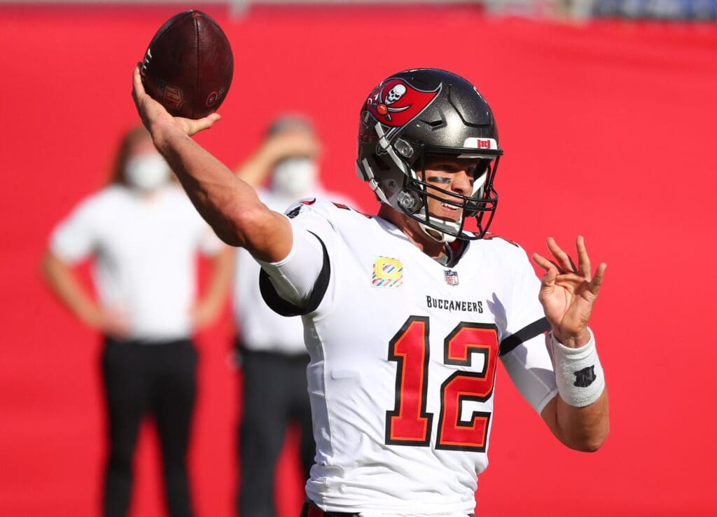 Oct 18, 2020; Tampa, Florida, USA; Tampa Bay Buccaneers quarterback Tom Brady (12) throws a pass against the Green Bay Packers during the first quarter of a NFL game at Raymond James Stadium.
