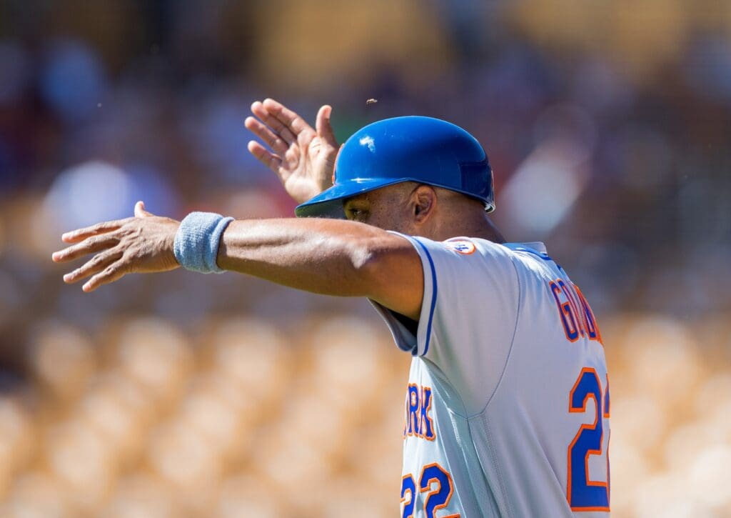 Oct 11, 2016; Glendale, AZ, USA; Scottsdale Scorpions manager Tom Goodwin of the New York Mets reacts as a bee flies near his head against the Glendale Desert Dogs during an Arizona Fall League game at Camelback Ranch.