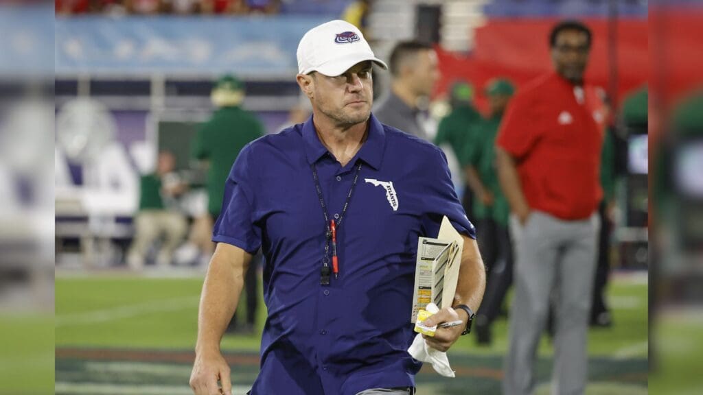 Nov 1, 2024; Boca Raton, Florida, USA; Florida Atlantic Owls head coach Tom Herman walks on the field before the game against the South Florida Bulls at FAU Stadium.