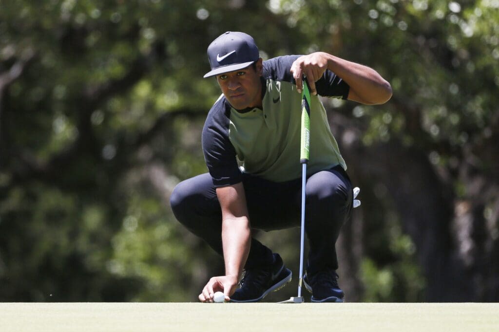 Apr 23, 2017; San Antonio, TX, USA; Tony Finau lines up a putt on the seventh green during the final round of the Valero Texas Open golf tournament at TPC San Antonio - AT&T Oaks Course.