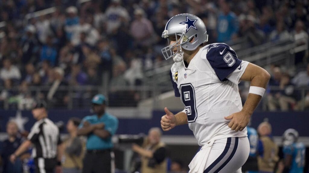 Nov 26, 2015; Arlington, TX, USA; Dallas Cowboys quarterback Tony Romo (9) comes off the field after throwing his second interception for a touchdown during the second quarter of an NFL game against the Carolina Panthers on Thanksgiving at AT&T Stadium