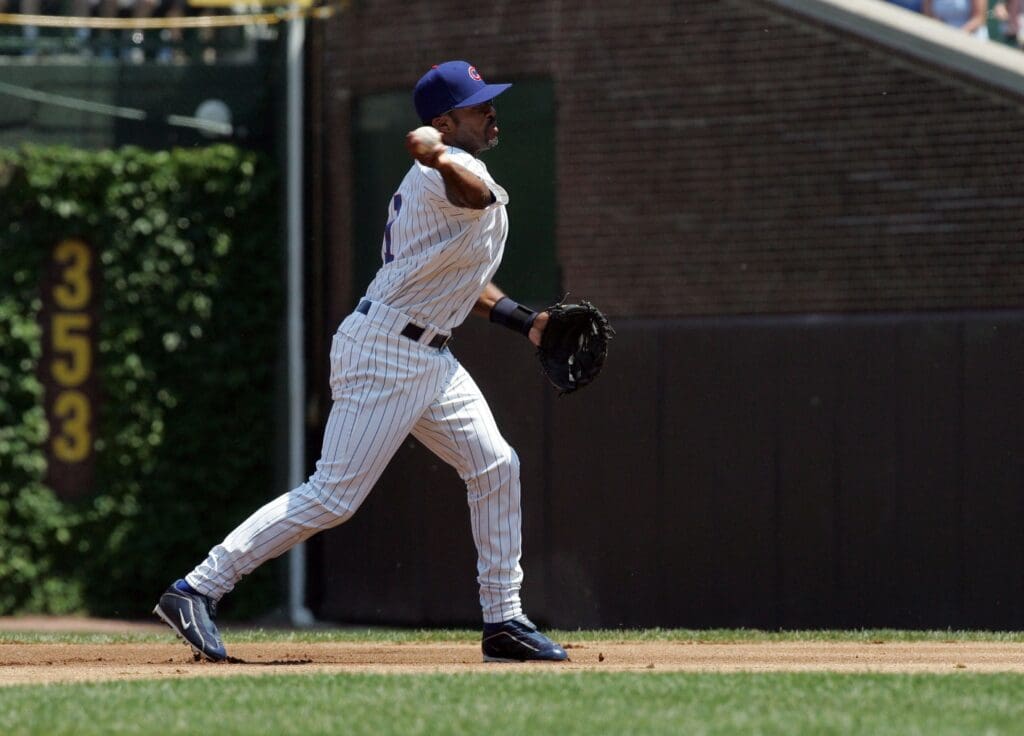 May 28, 2006; Chicago, IL, USA; Chicago Cubs second baseman (1) Tony Womack throws out Atlanta Braves third baseman (10) Chipper Jones(not pictured) in the 1st inning of their game at Wrigley Field.
