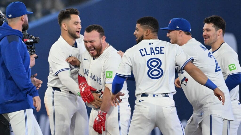 Jun 4, 2025; Toronto, Ontario, CAN; Toronto Blue Jays catcher Alejandro Kirk (30) celebrates with team mates after hitting a walkoff RBI double against the Philadelphia Phillies in the ninth inning at Rogers Centre.