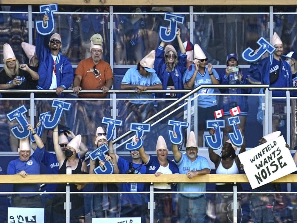 Aug 27, 2022; Toronto, Ontario, CAN; Toronto Blue Jays fans wear coneheads in tribute to former player David Cone (not pictured) during a ceremony for the 1992 World Series champion Toronto Blue Jays before a game against the Los Angeles Angels at Rogers Centre.
