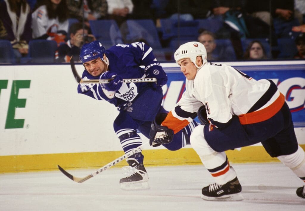 Feb 25, 1999; Uniondale, NY, USA; FILE PHOTO; Toronto Maple Leafs right wing Tie Domi (28) in action against New York Islanders defensemen Eric Brewer (4) at Nassau Coliseum.
