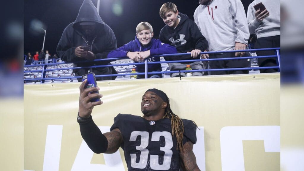 Feb 24, 2019; Atlanta, GA, USA; Birmingham Iron running back Trent Richardson (33) takes a selfie with fans after a game against the Atlanta Legends at Georgia State Stadium.