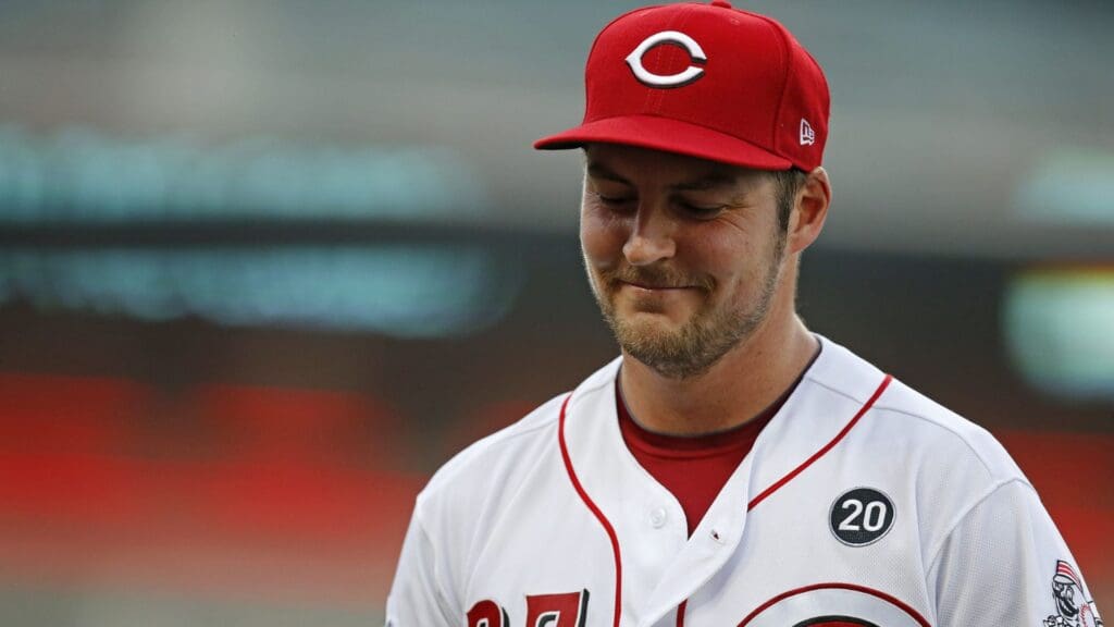 Cincinnati Reds starting pitcher Trevor Bauer (27) smiles as he returns to the dugout after the first inning against the San Diego Padres at Great American Ball Park on Aug. 19, 2019.