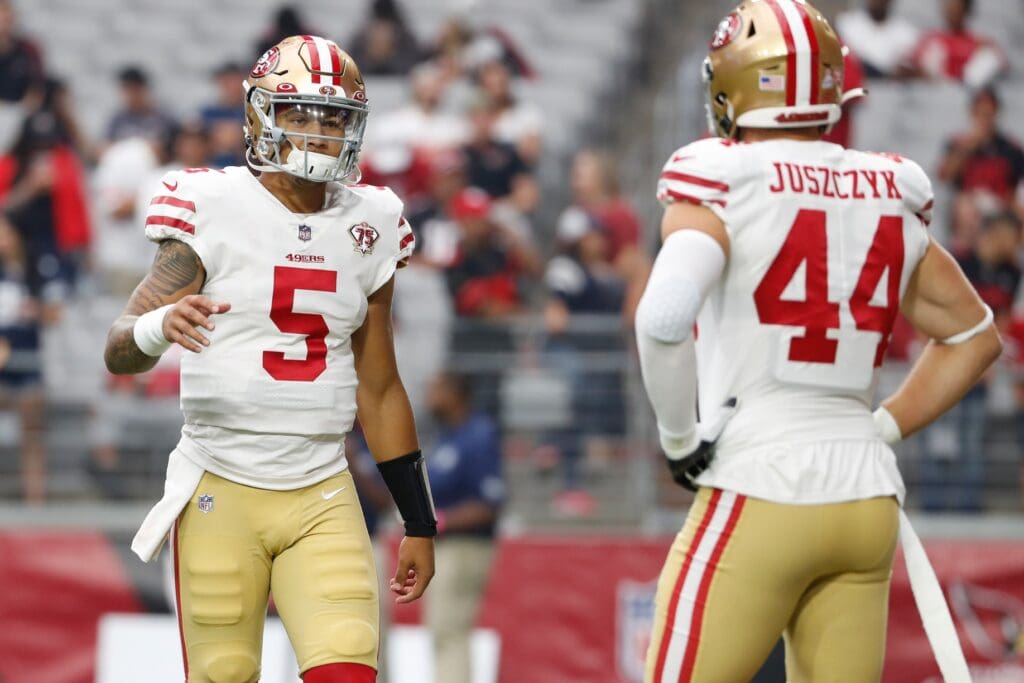 Oct 10, 2021; Glendale, Arizona, USA; San Francisco 49ers quarterback Trey Lance (5) warms up with fullback Kyle Juszczyk (44) before the game against the Arizona Cardinals at State Farm Stadium