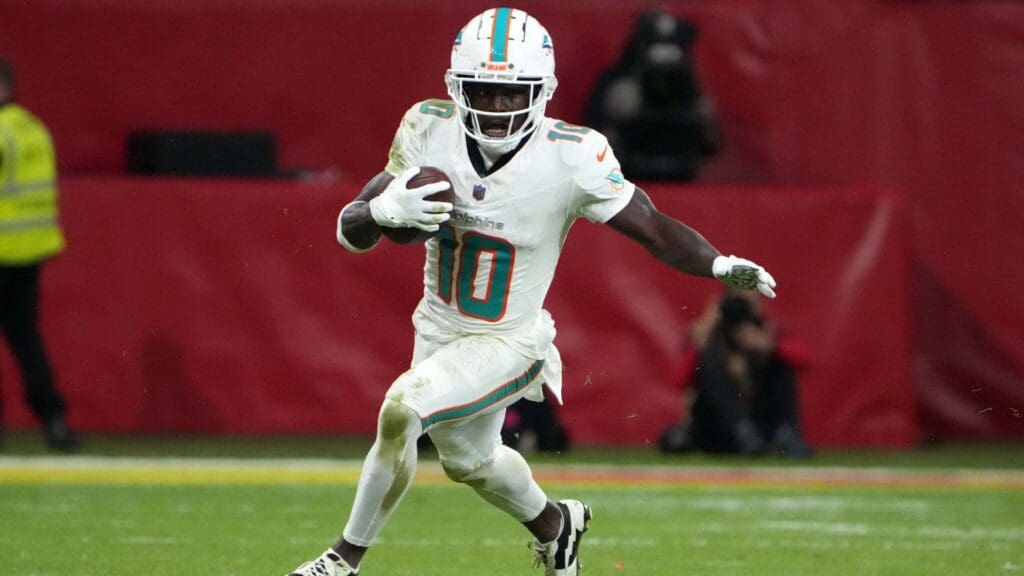 Nov 5, 2023; Frankfurt, Germany; Miami Dolphins wide receiver Tyreek Hill (10) carries the ball against the Kansas City Chiefs in the second half during an NFL International Series game at Deutsche Bank Park