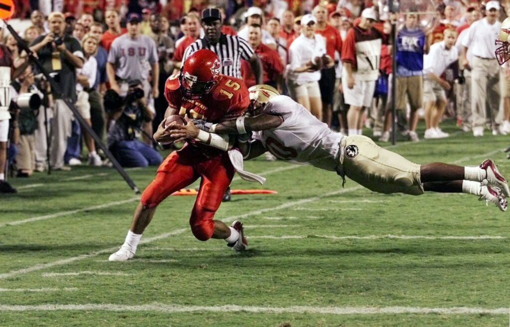 Aug. 24, 2002: Seneca Wallace is hit by Florida State's Stanford Samuels short of the goal line on the second to final play in the fourth quarter at Arrowhead Stadium in Kansas City.
Seneca Wallace 2002