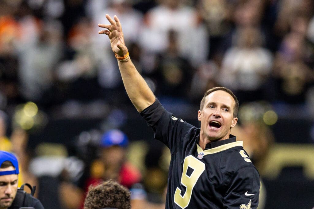 Oct 17, 2024; New Orleans, Louisiana, USA; Former New Orleans Saints quarterback Drew Brees on the field for the coin toss against the Denver Broncos during the first half at Caesars Superdome. Mandatory Credit: Stephen Lew-Imagn Images