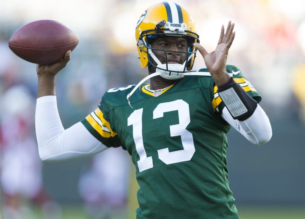 Aug 9, 2013; Green Bay, WI, USA; Green Bay Packers quarterback Vince Young (13) throws a pass during warmups prior to the game against the Arizona Cardinals at Lambeau Field