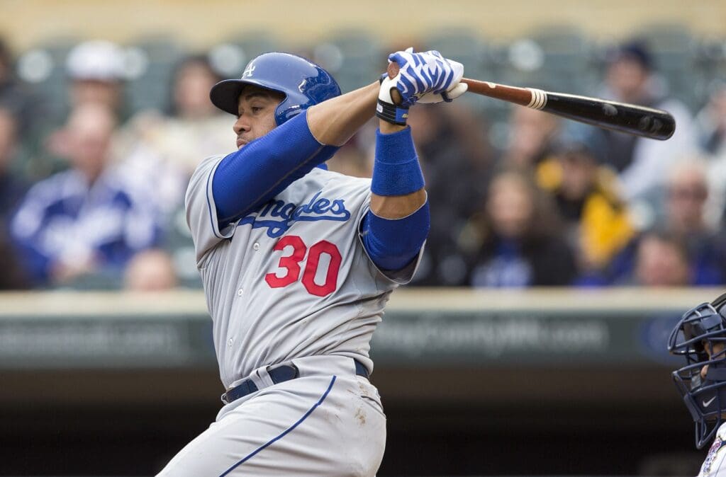 May 1, 2014; Minneapolis, MN, USA; Los Angeles Dodgers catcher Miguel Olivo (30) hits a RBI single in the seventh inning against the Minnesota Twins at Target Field. Mandatory Credit: Jesse Johnson-USA TODAY Sports