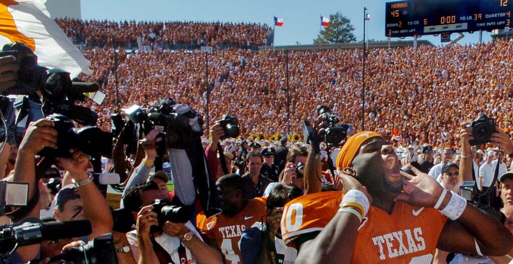 University of Texas quarterback Vince Young (10) celebrates the Longhorns' 45-12 victory over the University of Oklahoma with fans in the south stands of the Cotton Bowl in Dallas, Texas on Saturday, Oct. 8, 2005