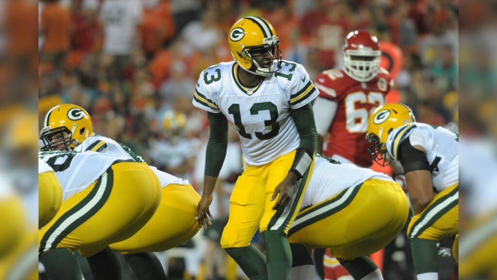 Aug 29, 2013; Kansas City, MO, USA; Green Bay Packers quarterback Vince Young (13) goes under center during the first half of the game against the Kansas City Chiefs at Arrowhead Stadium.