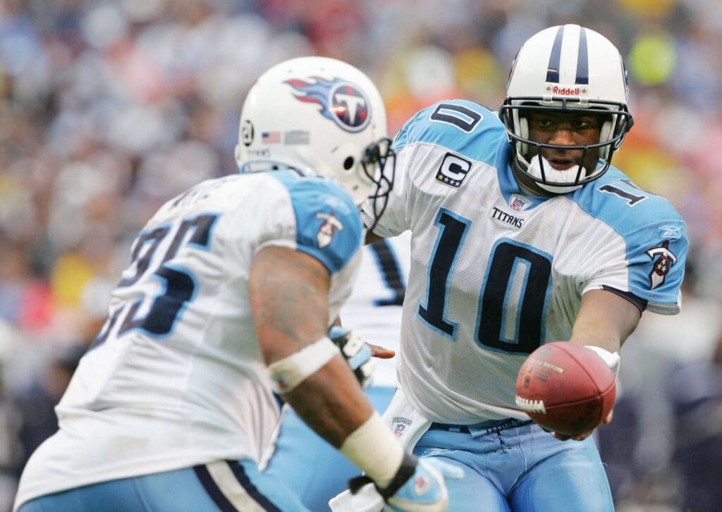 January 6, 2008; San Diego, CA, USA; Tennessee Titans quarterback Vince Young (10) hands off to running back LenDale White (25) against the San Diego Chargers in the first half during the AFC Wild Card game at Qualcomm Stadium.