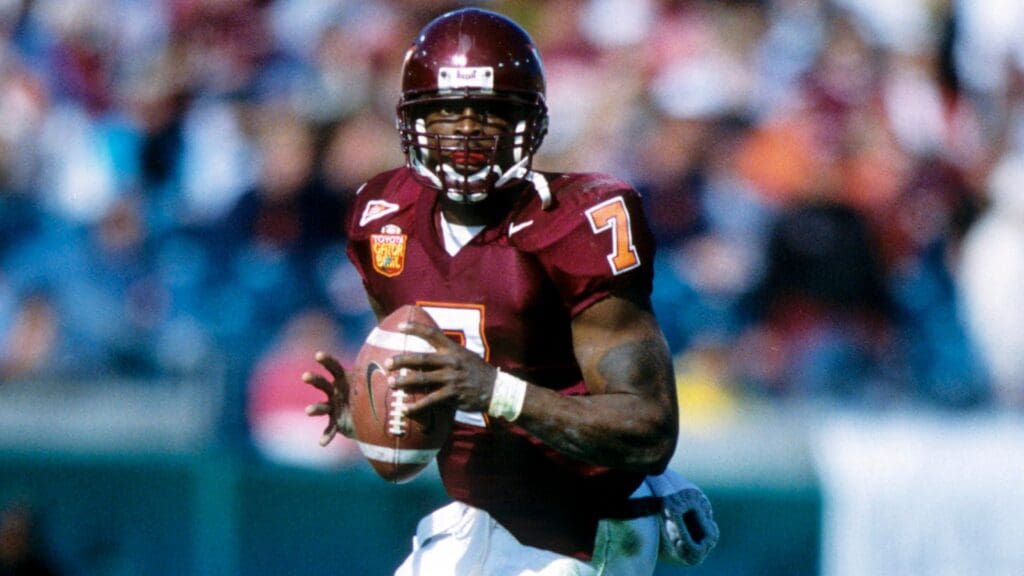 Jan 1, 2001; Jacksonville, FL, USA; FILE PHOTO; Virginia Tech Hokies quarterback Michael Vick (7) in action against the Clemson Tigers at the 2001 Gator Bowl. Virginia Tech Hokies won 41-20.