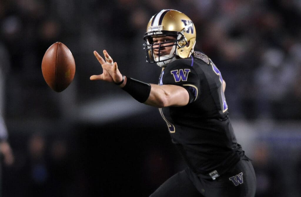 December 30, 2010; San Diego, CA, USA; Washington Huskies quarterback Jake Locker (10) runs the option in the second quarter against the Nebraska Cornhuskers during the Holiday Bowl at Qualcomm Stadium.