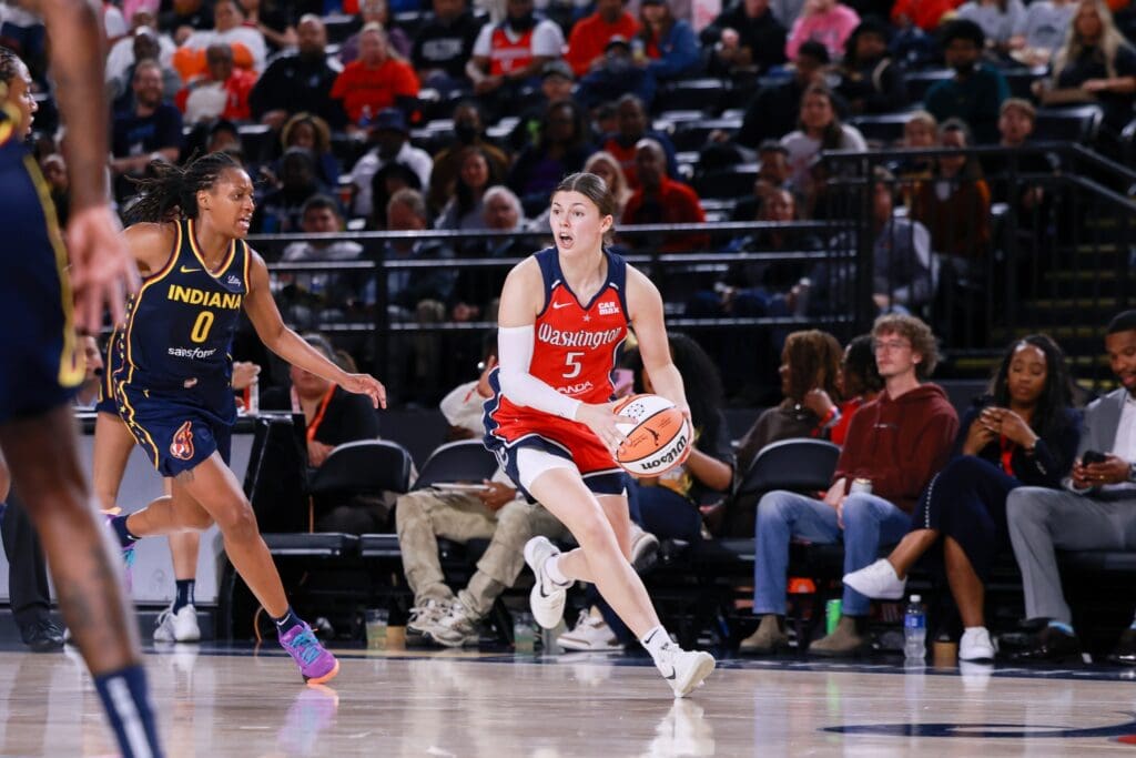 May 28, 2025; Washington, District of Columbia, USA; Washington Mystics guard Jade Melbourne (5) controls the ball while Indiana Fever guard Kelsey Mitchell (0) defends in the second half at Entertainment & Sports Arena.