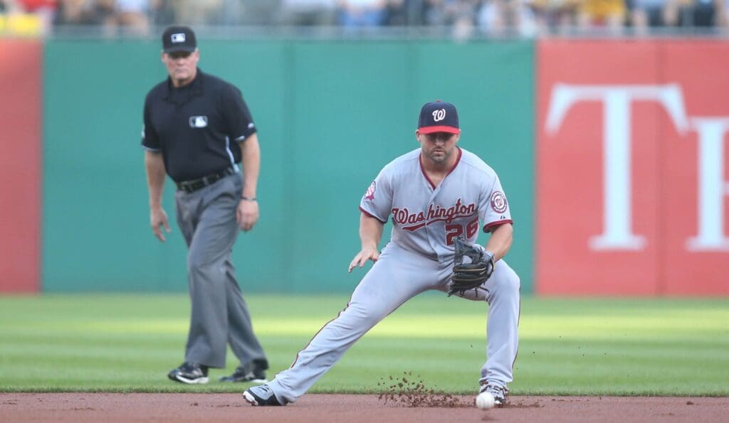 Jul 23, 2015; Pittsburgh, PA, USA; Washington Nationals second baseman Dan Uggla (26) fields a ground ball against the Pittsburgh Pirates during the first inning at PNC Park.