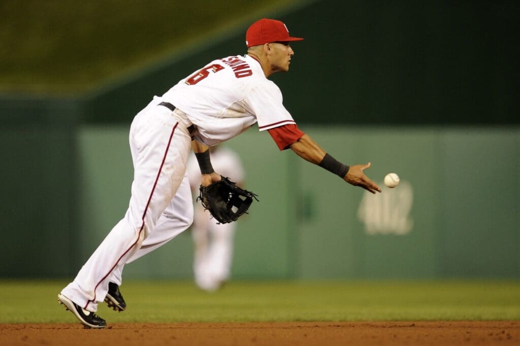 August 11, 2010; Washington, DC, USA; Washington Nationals shortstop Ian Desmond (6) flips the ball towards second base against the Florida Marlins at Nationals Park.