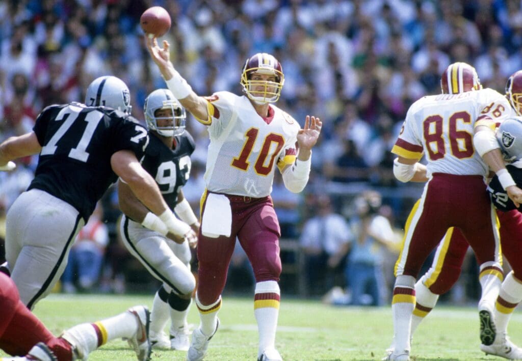 Sep 14, 1986; Washington, DC, USA; FILE PHOTO; Washington Redskins quarterback Jay Schroeder (10) in action against the Los Angeles Raiders at RFK Stadium.