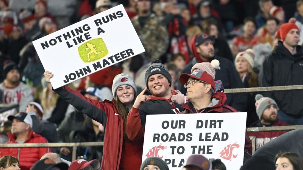 Washington State Cougars fans hold signs during a game against the Utah State Aggies in the first half at Gesa Field at Martin Stadium.