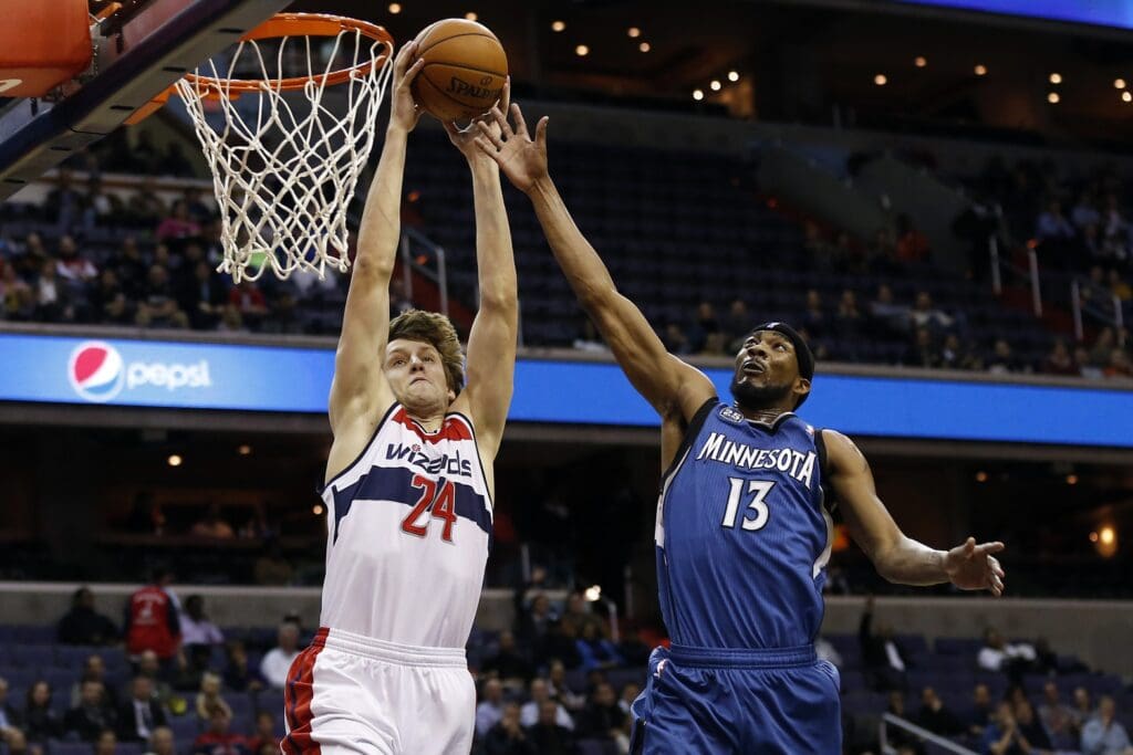 Nov 19, 2013; Washington, DC, USA; Washington Wizards power forward Jan Vesely (24) dunks the ball as Minnesota Timberwolves small forward Corey Brewer (13) defends in the second quarter at Verizon Center.