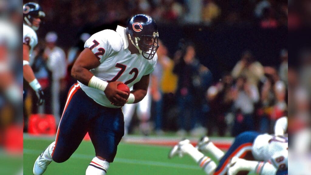 Jan 26, 1986; New Orleans, LA, USA; FILE PHOTO; Chicago Bears defensive tackle (72) William Perry, playing on offense, takes a handoff and runs the football against the New England Patriots during Super Bowl XX at the Superdome. The Bears defeated the Patriots 46-10.