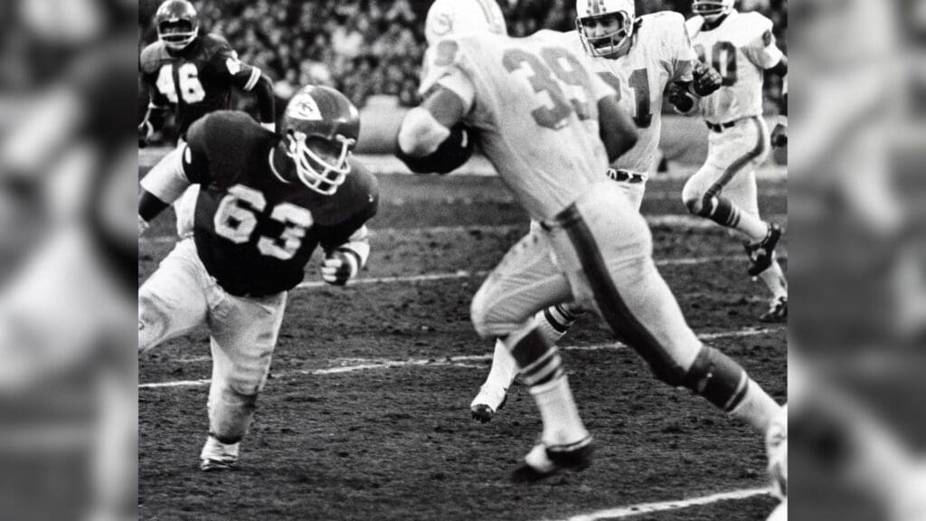 Dec. 25, 1971; Kansas City, MO, USA; FILE PHOTO; Kansas City Chiefs linebacker Willie Lanier (63) closes in on Miami Dolphins fullback Larry Csonka (39) at Municipal Stadium during the 1971 AFC Divisional Playoff game. Miami won 27-24 in two overtime periods in the longest game ever played in the NFL.