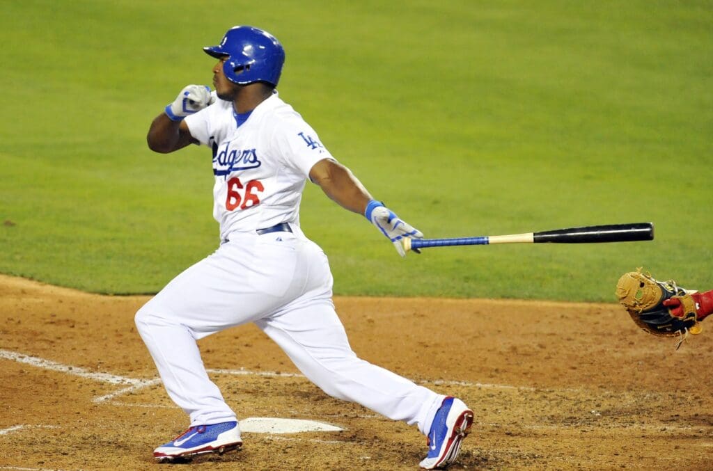 September 1, 2014; Los Angeles, CA, USA; Los Angeles Dodgers right fielder Yasiel Puig (66) hits a single in the seventh inning against the Washington Nationals at Dodger Stadium.