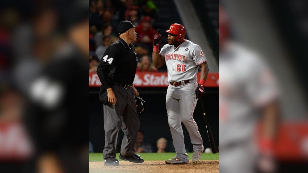 Jun 25, 2019; Anaheim, CA, USA; Cincinnati Reds right fielder Yasiel Puig (66) reacts after being thrown out of the game by umpire Kerwin Danley (44) during the sixth inning of the game against the Los Angeles Angels at Angel Stadium of Anaheim.