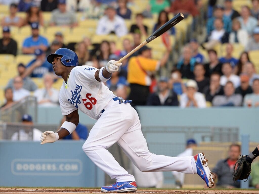 Jun 3, 2013; Los Angeles, CA, USA; Los Angeles Dodgers right fielder Yasiel Puig (66) connects on a single for his first major league hit in the first inning of the game against the San Diego Padres at Dodger Stadium.
