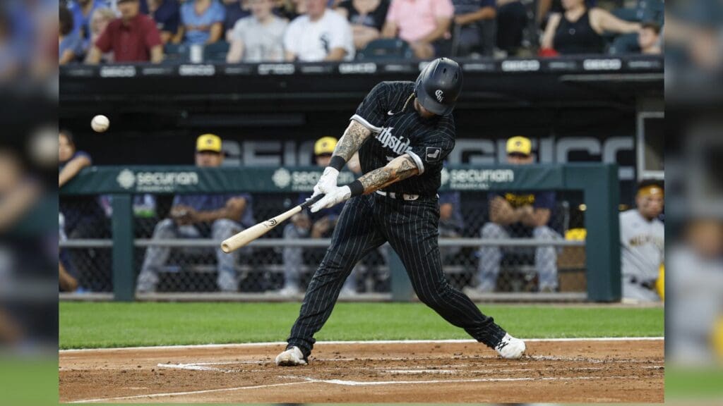 Aug 11, 2023; Chicago, Illinois, USA; Chicago White Sox catcher Yasmani Grandal (24) hits a RBI-sacrifice fly against the Milwaukee Brewers during the first inning at Guaranteed Rate Field.