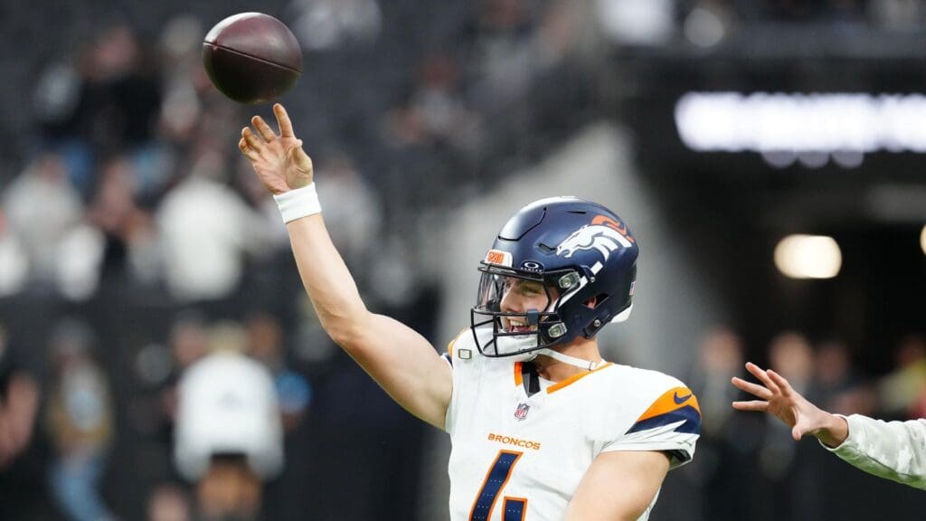 Nov 24, 2024; Paradise, Nevada, USA; Denver Broncos quarterback Zach Wilson (4) warms up before a game against the Las Vegas Raiders at Allegiant Stadium.