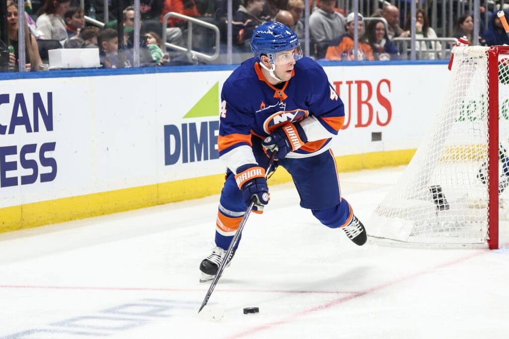 Apr 4, 2025; Elmont, New York, USA; New York Islanders defenseman Tony DeAngelo (4) controls the puck in the third period against the Minnesota Wild at UBS Arena.
