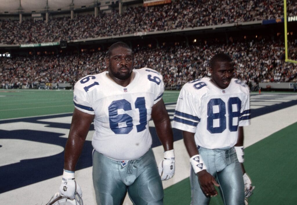 Oct 10, 1993, Indianapolis, IN, USA; FILE PHOTO; Dallas Cowboys guard Nate Newton (61) and receiver Michael Irvin (88) head off the field after the game against the Indianapolis Colts at the RCA Dome.