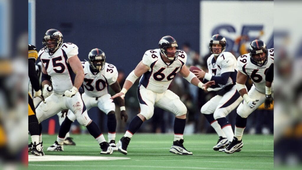 Jan 11, 1998; Pittsburgh, PA, USA; FILE PHOTO; Denver Broncos offensive players Brian Habib (75), Tom Nalen (66) and Mark Schlereth (69) block for quarterback John Elway (7) and running back Terrell Davis (30) against the Pittsburgh Steelers during the 1997 AFC Championship Game at Three Rivers Stadium. The Broncos defeated the Steelers 24-21.