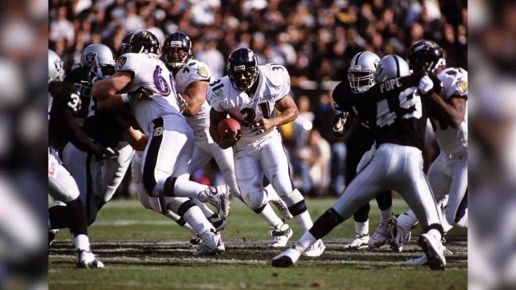 Jan 14, 2001; Oakland, CA, USA; FILE PHOTO; Baltimore Ravens running back Jamal Lewis (31) in action against Oakland Raiders defensive back Marquez Pope (49) during the 2000-01 AFC Championship game at Oakland Alameda Coliseum.