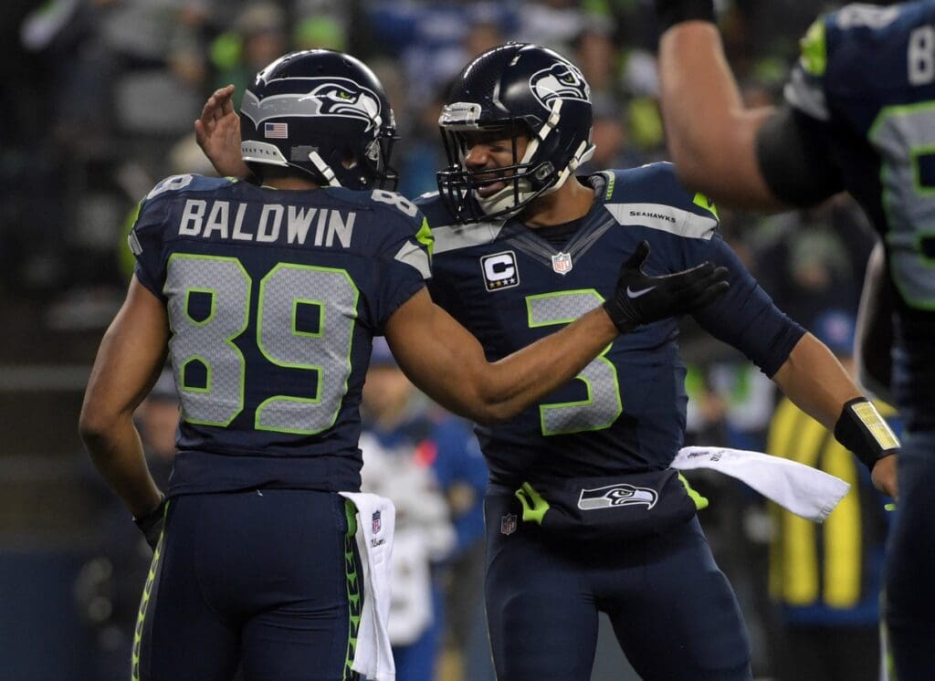 January 10, 2015; Seattle, WA, USA; Seattle Seahawks wide receiver Doug Baldwin (89) celebrates with quarterback Russell Wilson (3) after catching a touchdown pass against the Carolina Panthers during the first half in the 2014 NFC
