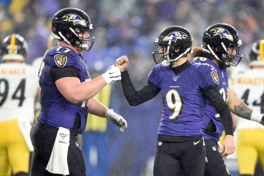 Dec 29, 2019; Baltimore, Maryland, USA; Baltimore Ravens kicker Justin Tucker (9) celebrates his second field goal in the first quarter with offensive guard Bradley Bozeman (77) agains the Pittsburgh Steelers at M&T Bank Stadium.