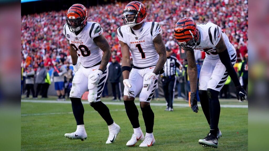 Cincinnati Bengals wide receiver Ja'Marr Chase (1), center, celebrates a touchdown catch with Cincinnati Bengals running back Joe Mixon (28), left, and Cincinnati Bengals wide receiver Tee Higgins (85), right, in the third quarter during the AFC championship NFL football game, Sunday, Jan. 30, 2022, at GEHA Field at Arrowhead Stadium in Kansas City, Mo. The Cincinnati Bengals defeated the Kansas City Chiefs, 27-24, to advance to the Super Bowl.